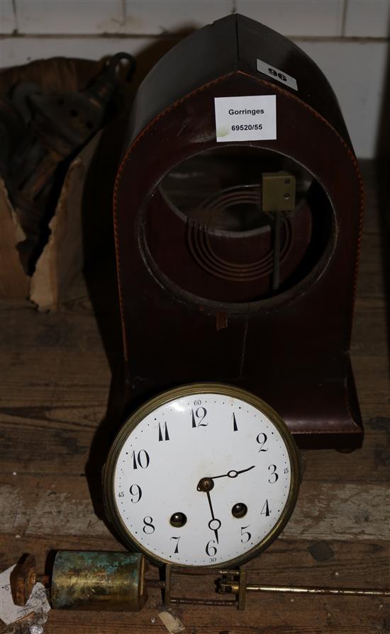 An Edwardian inlaid mahogany eight day lancet shaped mantel clock